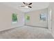 Expansive bedroom with three windows offers ample natural light and plush carpeting at 60 Wheeler Lake Path, Dallas, GA 30157