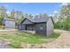 Stylish exterior showcasing modern design, a covered porch, and verdant lawn at 60 Wheeler Lake Path, Dallas, GA 30157