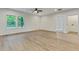 Bright living space featuring hardwood floors, a ceiling fan, and views of the outdoors at 60 Wheeler Lake Path, Dallas, GA 30157