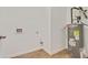 Utility room featuring a hot water tank and washer/dryer hookups at 60 Wheeler Lake Path, Dallas, GA 30157