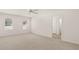 Large bedroom with natural light, neutral carpet and ceiling fan, creating a cozy atmosphere at 1316 Village Brook Drive, Dacula, GA 30019