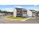 Beautiful two-story home features a brick and siding exterior, a two-car garage and a green lawn at 1316 Village Brook Drive, Dacula, GA 30019
