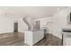 Bright kitchen features a center island, stainless steel appliances, granite countertops, and hardwood floors at 1316 Village Brook Drive, Dacula, GA 30019