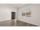 Bright living room with hardwood floors and large windows, creating an inviting and airy atmosphere at 1316 Village Brook Drive, Dacula, GA 30019