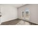 Bright living room featuring hardwood floors with natural light from glass doors at 1316 Village Brook Drive, Dacula, GA 30019