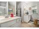 Bathroom featuring double sinks, tile floors, and natural light from the window at 2000 Suttles Sw Dr, Atlanta, GA 30331