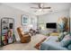 Bedroom with a ceiling fan, carpet, surf board decor and natural light at 2000 Suttles Sw Dr, Atlanta, GA 30331
