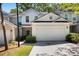 Charming townhome showcasing a two-car garage and well-maintained landscaping at 2000 Suttles Sw Dr, Atlanta, GA 30331