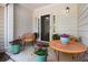 Inviting front porch featuring stylish seating and colorful potted plants at 2000 Suttles Sw Dr, Atlanta, GA 30331