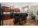 Modern kitchen with dark cabinetry, granite countertops, and stainless steel appliances at 2000 Suttles Sw Dr, Atlanta, GA 30331