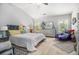 Spacious main bedroom featuring a ceiling fan, windows with natural light, and neutral walls at 2000 Suttles Sw Dr, Atlanta, GA 30331