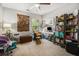 Bright office with carpet, natural light, ceiling fan, desk, and shelving at 2000 Suttles Sw Dr, Atlanta, GA 30331