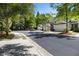 Well-maintained townhomes with attached garages line a quiet street, showcasing curb appeal at 2000 Suttles Sw Dr, Atlanta, GA 30331