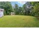 Expansive backyard offers plenty of space for recreation and relaxation in a lush, green setting at 4125 Hickory Dr, Powder Springs, GA 30127