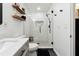 This bathroom features a tiled walk-in shower with glass enclosure and a modern white vanity at 4125 Hickory Dr, Powder Springs, GA 30127