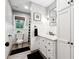 This bathroom features vintage fixtures, stylish decor, and a shower-tub combination at 4125 Hickory Dr, Powder Springs, GA 30127