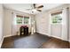 Bedroom with hardwood floors, two windows offering natural light and light neutral walls at 4125 Hickory Dr, Powder Springs, GA 30127