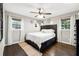 The cozy bedroom features hardwood floors, natural lighting, and a ceiling fan at 4125 Hickory Dr, Powder Springs, GA 30127