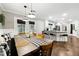 Open dining area offers bench seating, modern lighting, and seamless kitchen access at 4125 Hickory Dr, Powder Springs, GA 30127