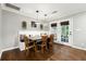 Comfortable dining area boasts bench seating, warm lighting, and backyard views at 4125 Hickory Dr, Powder Springs, GA 30127