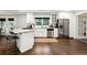 Modern kitchen featuring white cabinets, granite countertops, and stainless steel appliances at 4125 Hickory Dr, Powder Springs, GA 30127