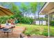 Backyard with a wooden patio, playset, shed, and lush green lawn at 4128 Morgan Rd, Tucker, GA 30084