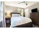 Bedroom featuring a large window, neutral walls, and hardwood flooring at 4128 Morgan Rd, Tucker, GA 30084