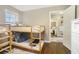 bedroom with a wood frame bunk bed and hardwood floors at 4128 Morgan Rd, Tucker, GA 30084