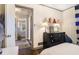 Cozy bedroom with view into the hallway, white walls, and hardwood flooring at 4128 Morgan Rd, Tucker, GA 30084