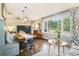 Bright and airy dining area featuring a large window and hardwood floors at 4128 Morgan Rd, Tucker, GA 30084