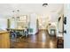 Stylish dining area with a long wooden table and adjacent, modern white kitchen at 4128 Morgan Rd, Tucker, GA 30084