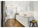 Bright kitchen with white cabinets, countertops, and stainless steel appliances at 4128 Morgan Rd, Tucker, GA 30084