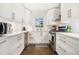Well-lit kitchen with white cabinets, stainless steel appliances, and a window above the sink at 4128 Morgan Rd, Tucker, GA 30084