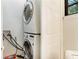 Functional laundry area with stacked washer and dryer and storage at 4128 Morgan Rd, Tucker, GA 30084