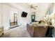 Bright living room showcasing a large TV, comfortable seating, and an open layout to the kitchen at 4128 Morgan Rd, Tucker, GA 30084