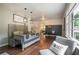 Comfortable living area with hardwood floors, dining space, and a glimpse into the bright kitchen at 4128 Morgan Rd, Tucker, GA 30084