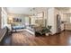 Inviting living space with hardwood floors, stylish furnishings, and seamless flow into dining and kitchen at 4128 Morgan Rd, Tucker, GA 30084