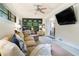 Cozy living room with a plush sofa, built-in bookcase, and a large window at 4128 Morgan Rd, Tucker, GA 30084