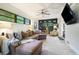 Comfortable living room with large sectional sofa, built-in shelving, and a mounted TV at 4128 Morgan Rd, Tucker, GA 30084
