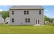 A well-kept backyard featuring a two-story home with gray siding, and a freshly cut lawn at 4827 Golden Finch Ln, Powder Springs, GA 30127