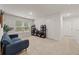 This bonus room offers natural light and neutral walls, perfect for a play area or additional living space at 4827 Golden Finch Ln, Powder Springs, GA 30127