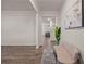 Bright foyer with hardwood floors and neutral walls, leading to the living area at 4827 Golden Finch Ln, Powder Springs, GA 30127