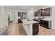 Modern kitchen with a large island, stainless steel appliances, and an open floor plan at 4827 Golden Finch Ln, Powder Springs, GA 30127