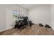 Home office with hardwood floors and a large window offering natural light at 4827 Golden Finch Ln, Powder Springs, GA 30127