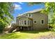 Backyard of home with stairs leading to deck at 5215 Tealing Ne Dr, Roswell, GA 30075