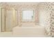 Bathroom featuring a tub and a glass door shower at 5215 Tealing Ne Dr, Roswell, GA 30075