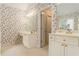 Bathroom featuring dual vanities with floral wallpaper at 5215 Tealing Ne Dr, Roswell, GA 30075
