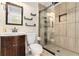Bathroom with a modern vanity, contemporary fixtures, and tile shower at 5215 Tealing Ne Dr, Roswell, GA 30075