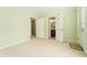Spacious bedroom featuring neutral colors, plush carpet, and access to an en-suite bath at 5215 Tealing Ne Dr, Roswell, GA 30075