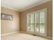 Bedroom featuring plantation shutters, carpet floors, and trim at 5215 Tealing Ne Dr, Roswell, GA 30075